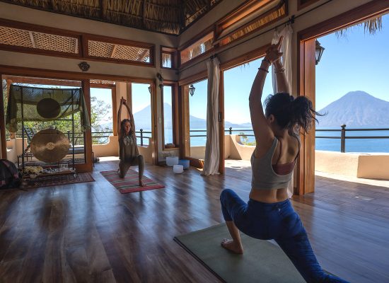 school of yoga class with lake views
