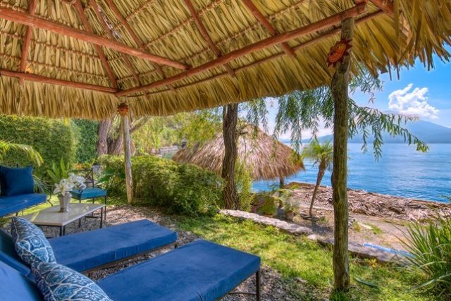 two lounge chairs lakefront lake atitlan guatemala