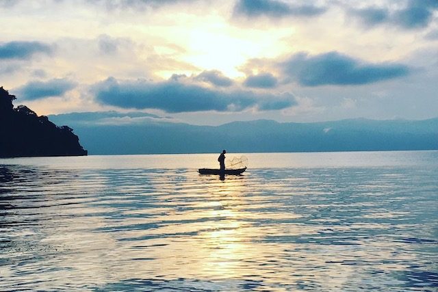 mayan culture man fishing on lake atitlan